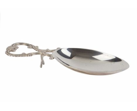  A Channel Islands silver caddy or medicine spoon Bruce Russell, Guernsey, oval bowl with twin scroll handle, integral trivet