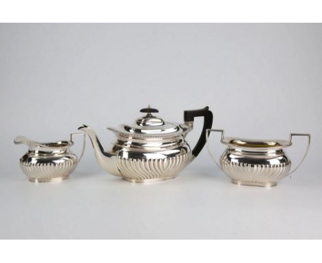  A George V silver matched three piece tea service W. & C. Sissons, London 1913 / 1914 and Sheffield 1913, of half reeded bom