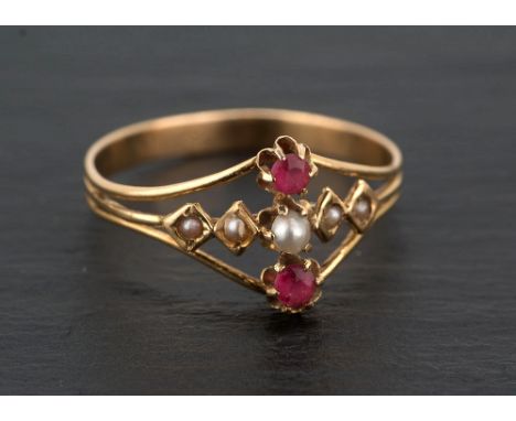  A 19th century 18ct gold, pearl and ruby ring the open setting with central row of five graduated seed pearls between two ro