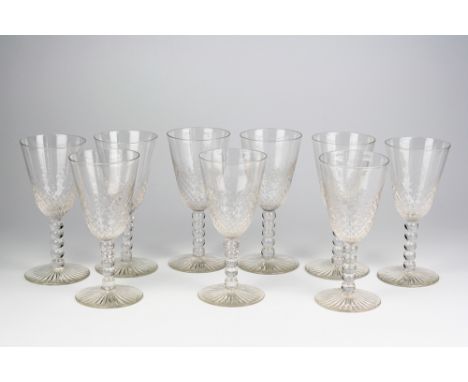  A set of nine wine glasses c.1900, the elongated round funnel bowl with half honeycomb moulded decoration, on bobbin stem wi