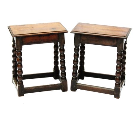  A pair of late 17th or early 18th century fruitwood joint stools probably Continental, the moulded top over a channel border