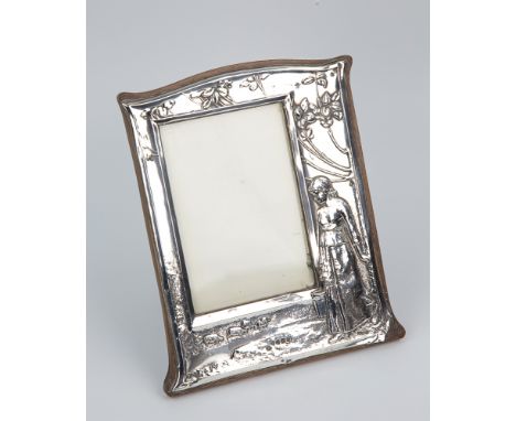  An Edwardian Arts & Crafts style silver mounted photograph frame Charles S. Green & Co. Ltd., Birmingham 1905, arched rectan