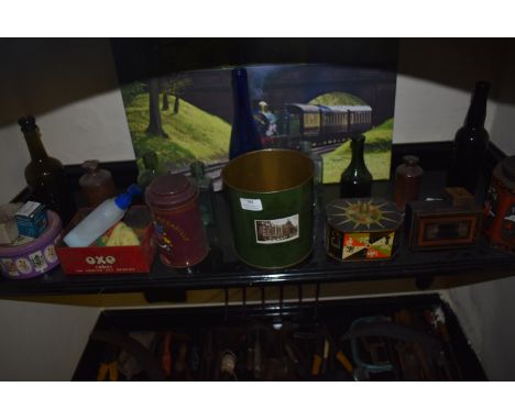 Shelf of Tins, Glass Bottles, Picture of a Train, etc.