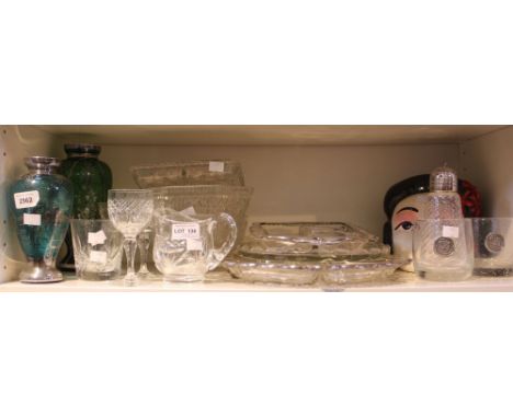 A shelf of glass and china domestic items