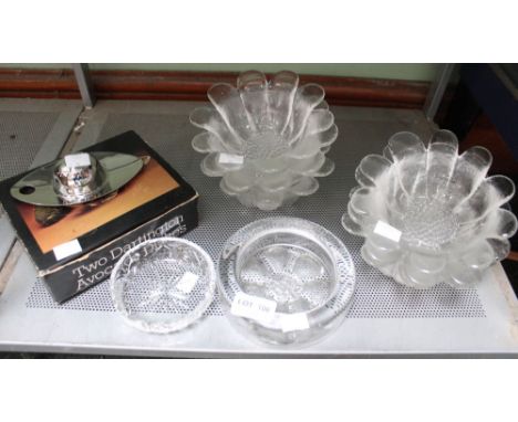 A shelf containing a collection of glassware, Dartington etc