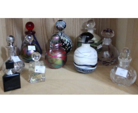 A shelf containing a selection of modern art glass scent bottles including named examples (11)
