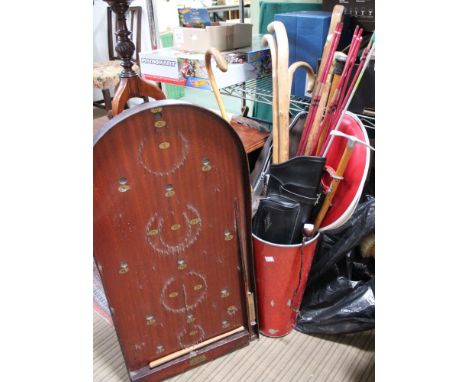 A "Samwha" archery bow and a sheath of arrows, various walking sticks and canes, one with a silver handle, a truncheon and a 