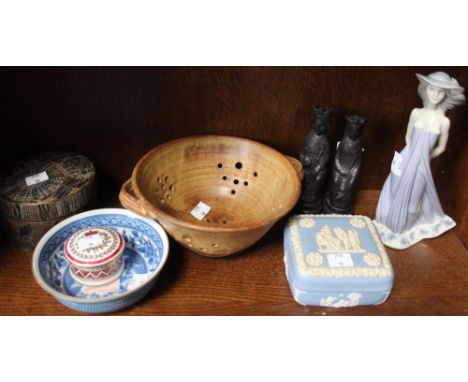 A shelf of ceramic collectables