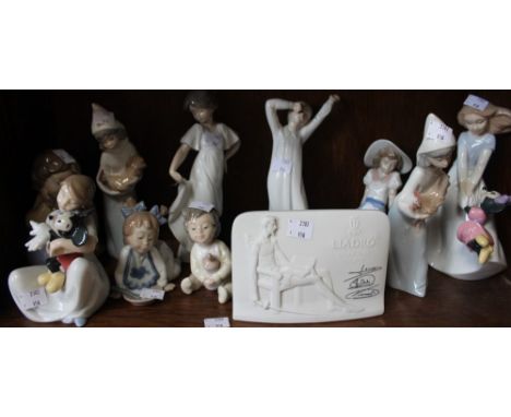 A shelf containing a good selection of Lladro and Nao figurines, including a Lladro Collectors plaque (11)
