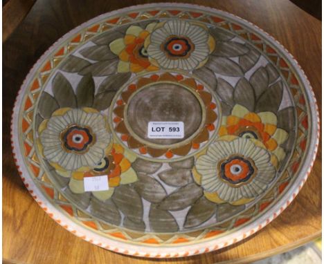 A Charlotte Rhead pottery wall charger, tube lined and painted "Golden Leaves" design, signed to reverse, 32cm diameter