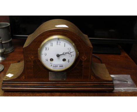 A 19th century mantel clock with presentation plaque dated 1931