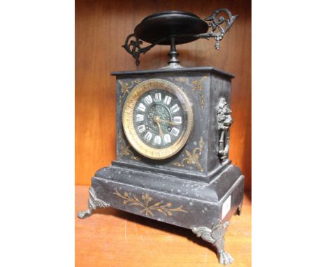 A mantel clock Condition: Chip to slate dish top, a few minor chips to slate body, the top "dish" revolves / loose, has pendu
