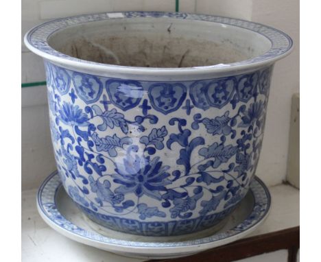 An Oriental design ceramic planter with base, blue and white decoration
