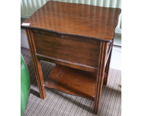 A early 20th Century oak sewing box with under tier shelf