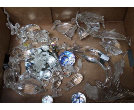 A collection of Swarovski animals etc, includes Dolphin, Whale, Rhino, Duck, Poodle etc, unboxed together with some empty box