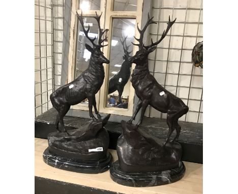 PAIR OF BRONZE HIGHLAND STAGS - EACH 74CM HEIGHT, WIDTH 16.5CM &amp; DEPTH 34CM - STAG HAS FIRE CRACKS IN THE BASE