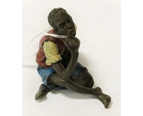 PAINTED BRONZE SEATED ARAB BOY APP.SIZE:APP.WEIGHT: