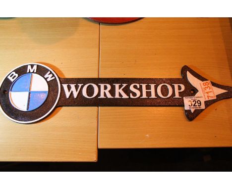 Cast iron BMW workshop arrow sign, L: 46 cm. P&amp;P Group 1 (£14+VAT for the first lot and £1+VAT for subsequent lots) 