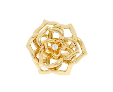 Piaget, bague or 750 stylisant une rose aux pétales ajourés centrant un diamant taille brillant, signée, numérotée G85487, do