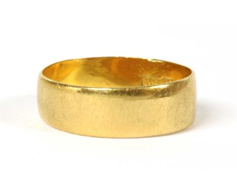 A 22ct gold wedding ring, Birmingham 1911, 3.22g. Finger size O (approximately)Condition report: Band not round. Surface mark