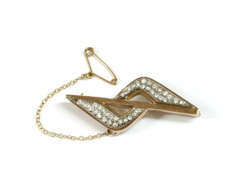 A gold diamond set brooch, a central polished bar with wings above and below pavé set with brilliant cut diamonds, to pin, ro