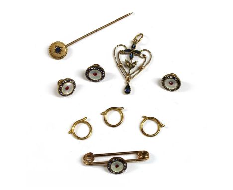 An Edwardian gold paste and split pearl pendant, the whiplash frame set with paste quatrefoil and suspending a paste drop, ma