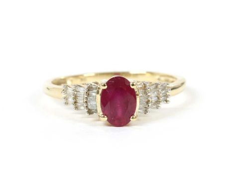 A gold ruby and diamond ring, an oval mixed cut ruby, possibly fracture filled , claw set to graduated stepped shoulders set 