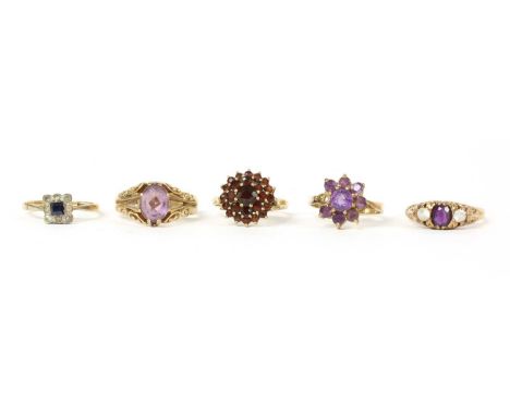 A 9ct gold single stone amethyst ring, Birmingham 1973, a gold amethyst and paste ring, tested as approximately 9ct gold, a 9