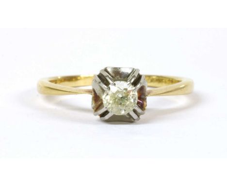 A gold single stone diamond ring, an old brilliant cut diamond double claw set to a square white gold collet, with yellow gol