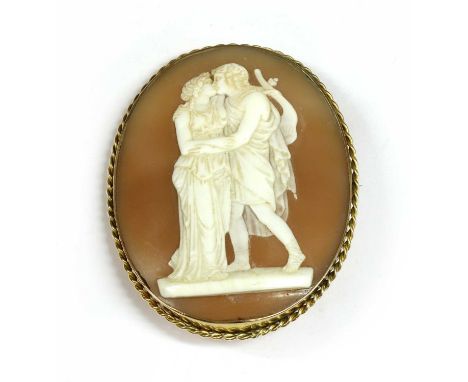 A gold shell cameo brooch, depicting a couple, possibly Orpheus and Eurydice, in white to a pale brown ground, rub set with a