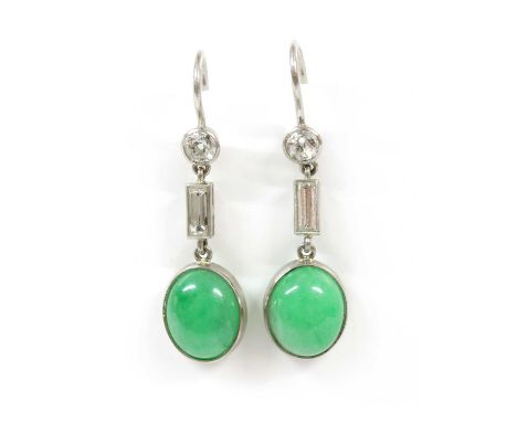 A pair of platinum jade and diamond earrings, with an oval cabochon jadeite jade, rub set, surmounted with a baguette cut dia