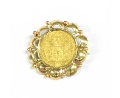 A 1915 gold Austrian ducat coin, bezel set to a scalloped border, with brooch pin and roller catch, and pendant loop, marked 