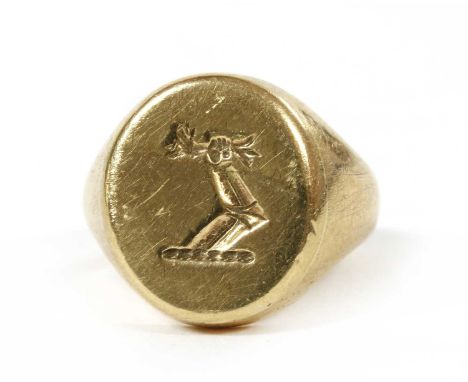 A 9ct gold signet ring, possibly by Cropp &amp; Farr, the oval head with intaglio engraved crest, to tapered shoulders and a 