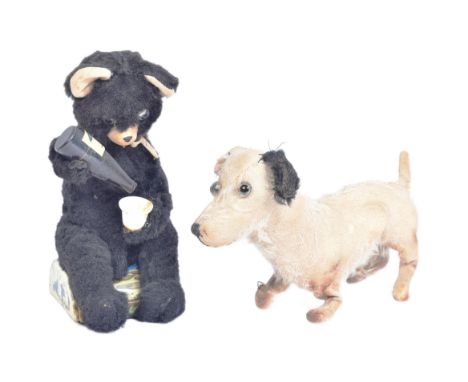 A vintage Japanese (Alps) made tinplate battery operated picnic bear along with an early 20th Century soft toy in the form of
