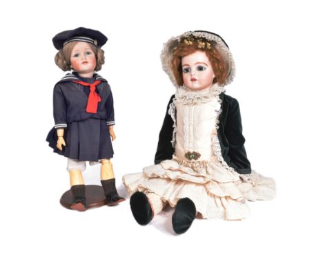 Two early 20th Century style reproduction dolls comprising a large French Bru doll and a smaller German&nbsp;Kammer &amp; Rei
