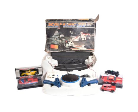 Scalextric - an original vintage Hornby Scalextric 200 slot car racing set No. C559 along with additional cars. The set conta