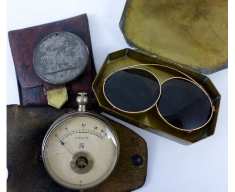 Cased hand held volt meter, commemorative coin and brass boxed vintage sunglasses