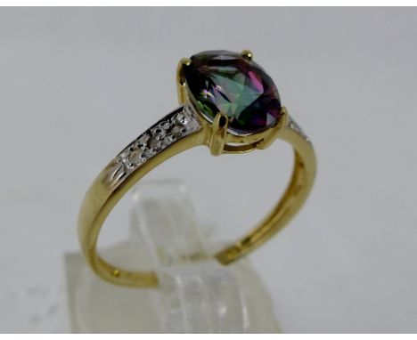 9 ct gold mystic topaz ring with diamond shoulders. Size O.
