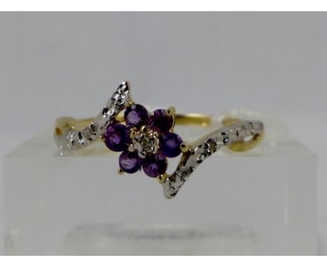 9 ct gold amethyst & diamond flower head ring. Size O.
