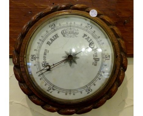 Curved rope edged oak aneroid vintage circular barometer D: 19 cms