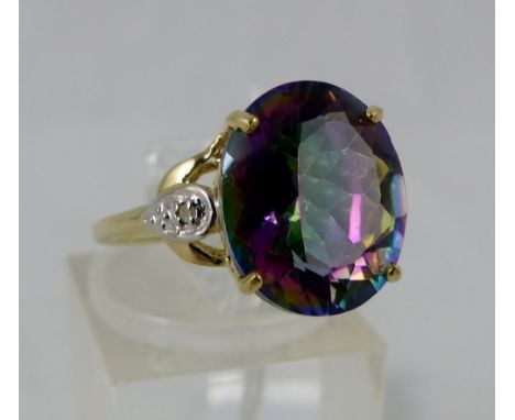 9 ct gold mystic topaz ring with diamond shoulders. Size O.