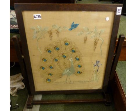 Oak framed firescreen with peacock embroidered design. H: 74 cm