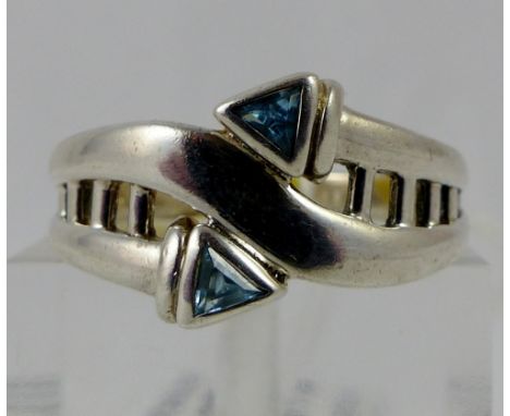 Sterling silver fancy ring set with trillion cut blue topaz, size S