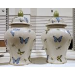 Pair of India Jane vases with covers, decorated with butterflies, dragonflies and beetles, on a