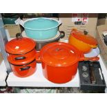 Le Creuset cast iron and turquoise enamel casserole, a Le Creuset cast iron and orange enamel