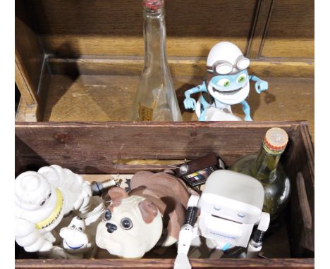 Cast iron Michelin man doorstop, an Eric Wornquist Pirahna Studios Crazy Frog model, a small vintage leather suitcase, etc&nb