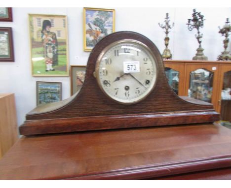 An oak 8 day mantel clock