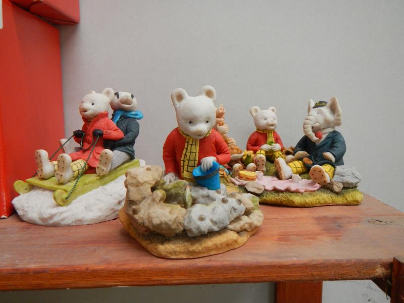 A collection of 4 Arden Rupert the Bear figurines (all boxed)