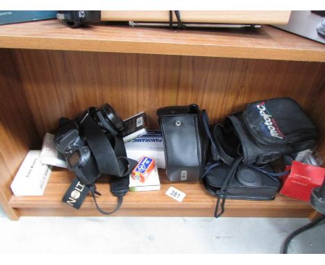 A camera and other photographic items