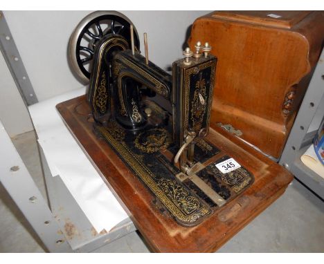 A cased vintage sewing machine